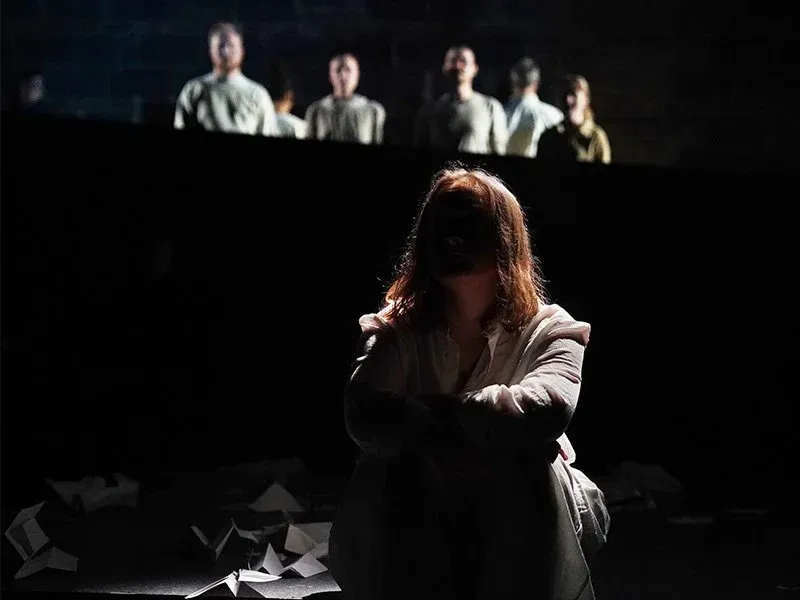Performer onstage at the Voxel Theater during Nobody Is Ever Missing